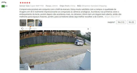 4K 8MP outdoor security camera feed capturing a street with a white van beside a construction fence.